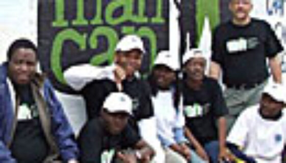 Sonke Staff in front of OMC mural