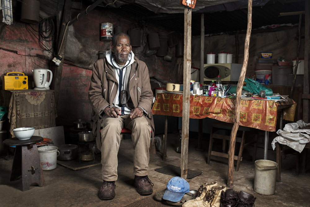 Zonisele Nkompela in his home outside Queenstown. He travels back to his family once a month.